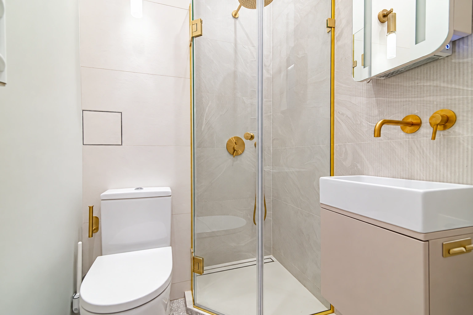 The bathroom has a shower enclosure, a toilet and a washbasin with a cabinet.